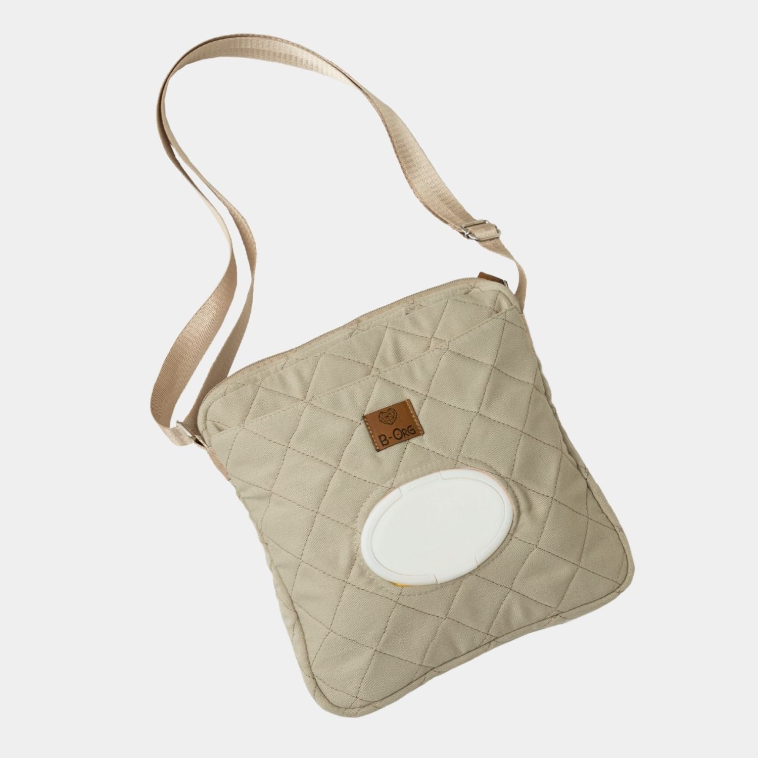 Cross Bag en color Beige. Cartera versátil y cómoda para llevar tus esenciales y los esenciales de tu bebé para una salida rápida al parque, al banco o al súper, donde no necesitas muchas cosas pero debes lista para todo.
