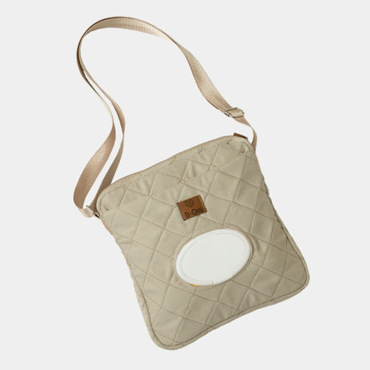 Cross Bag en color Beige. Cartera versátil y cómoda para llevar tus esenciales y los esenciales de tu bebé para una salida rápida al parque, al banco o al súper, donde no necesitas muchas cosas pero debes lista para todo.